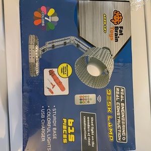 Fat brain toys desk lamp. Unopened package but slight rip in plastic as shown